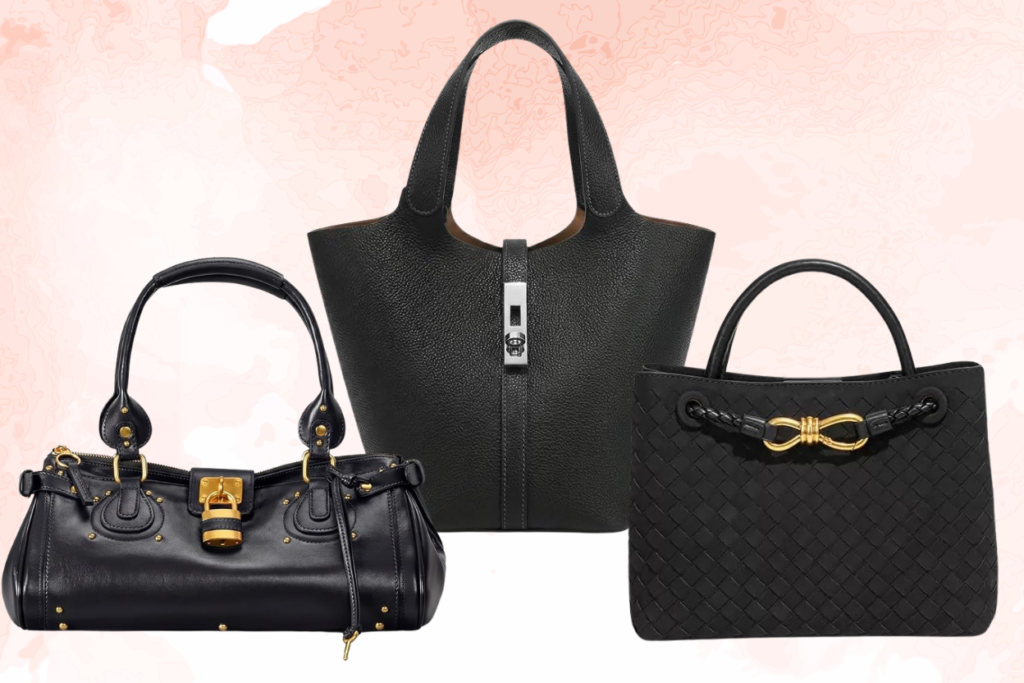 Three black women’s handbags a satchel and two totes with gold and silver hardware on a soft pink background.